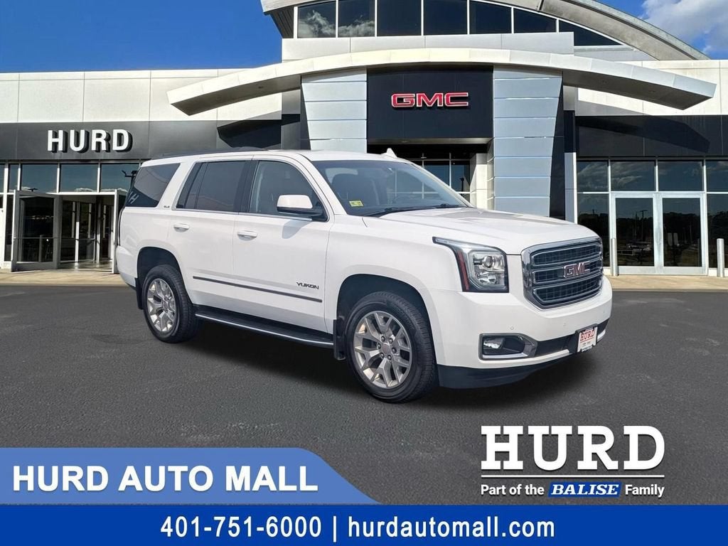 2019 GMC Yukon SLE in Summit White — front three-quarter view